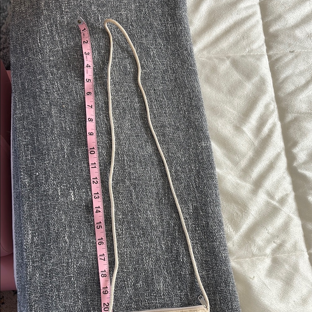 Cream Cord on crossbody bag.
